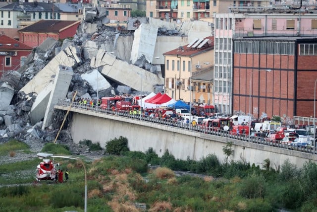 Part of the A10 freeway which collapsed Tuesday fell on to the road below, crushing vehicles beneath. Photo: Valery Hache / AFP